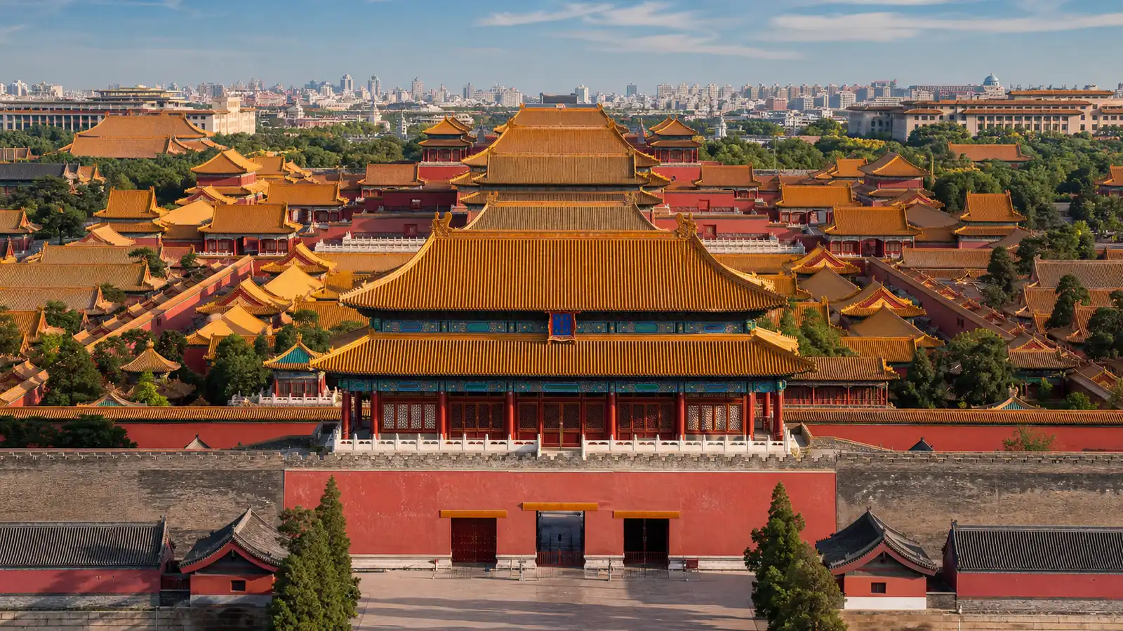 Golden rooftops and red walls of the Forbidden City in Beijing under a clear sky