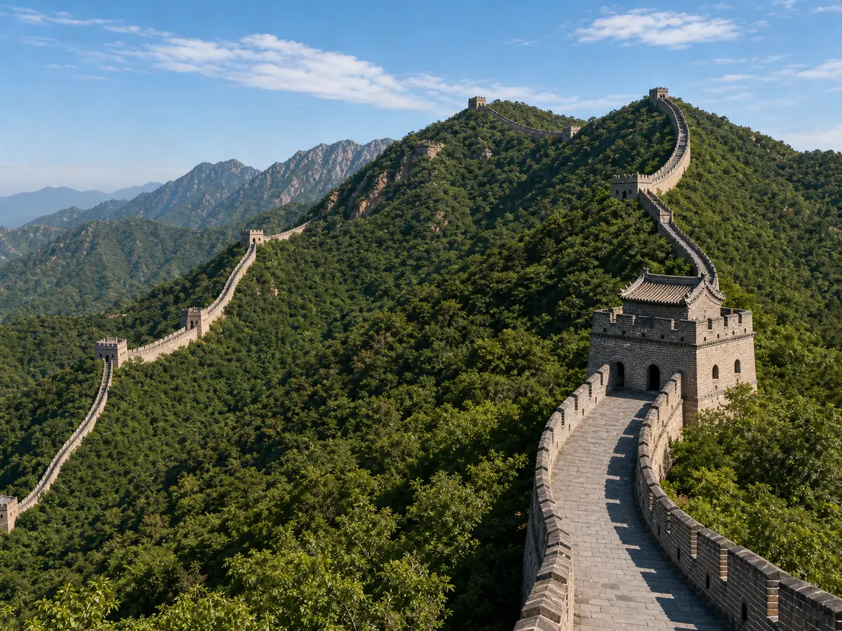 The Great Wall of China stretching across forested mountains
